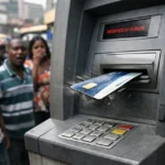 ATM machine ejecting debit card after low balance rejection in Kampala
